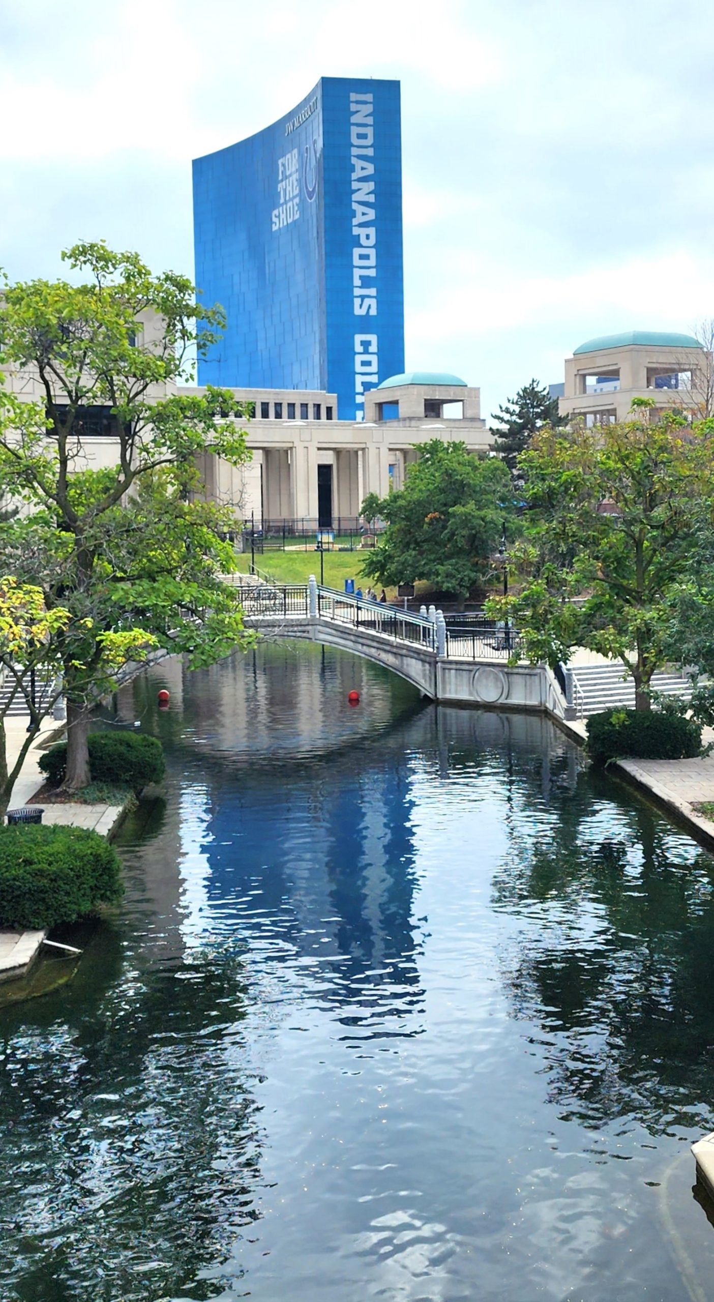 The Marriot hotel with the words "Indianapolis Colts" on the side is in the background of the Indianapolis canal walk.