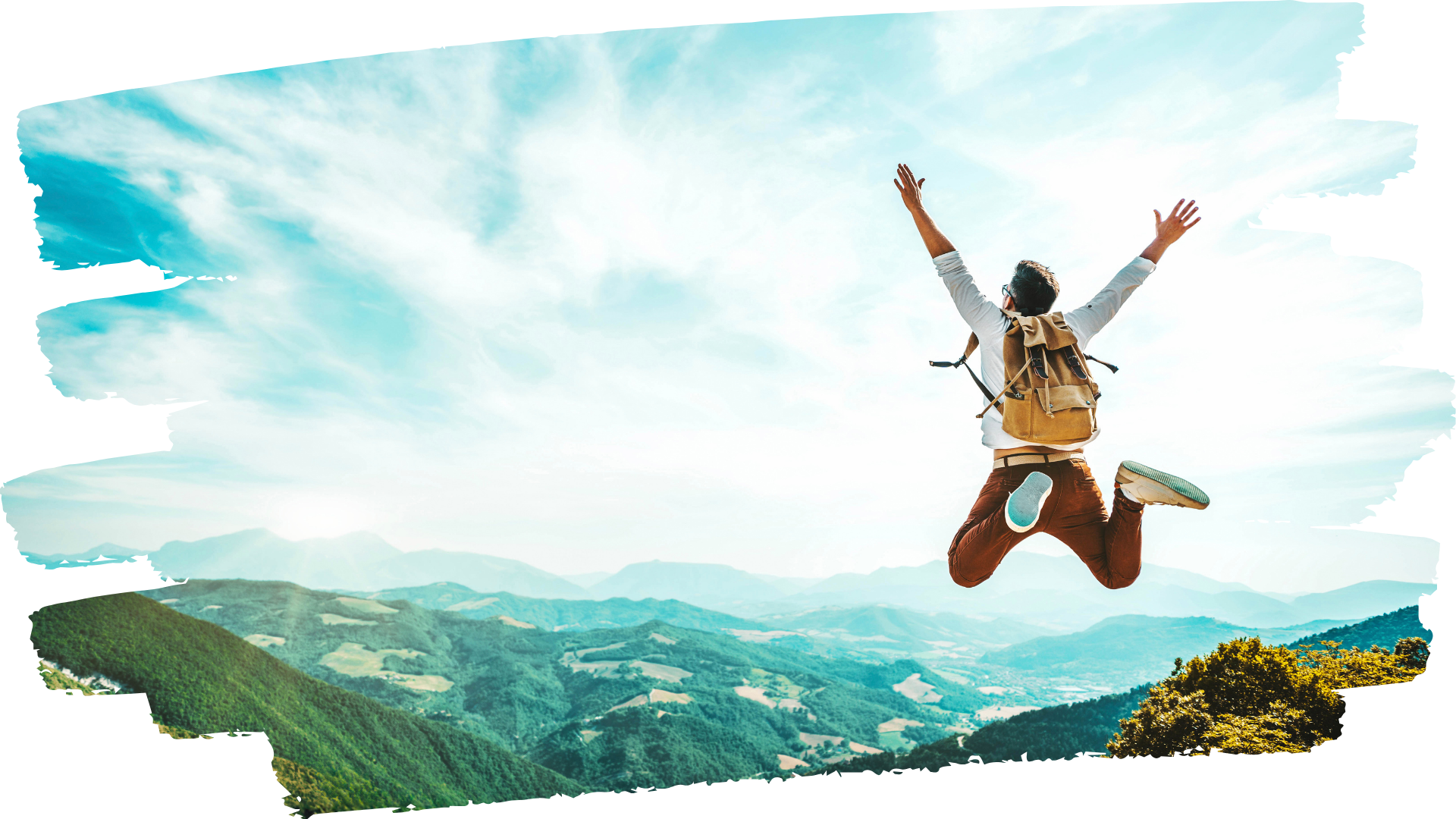 Person with backpack jumping with joy on a mountain top with a blue sky and other mountain peaks below