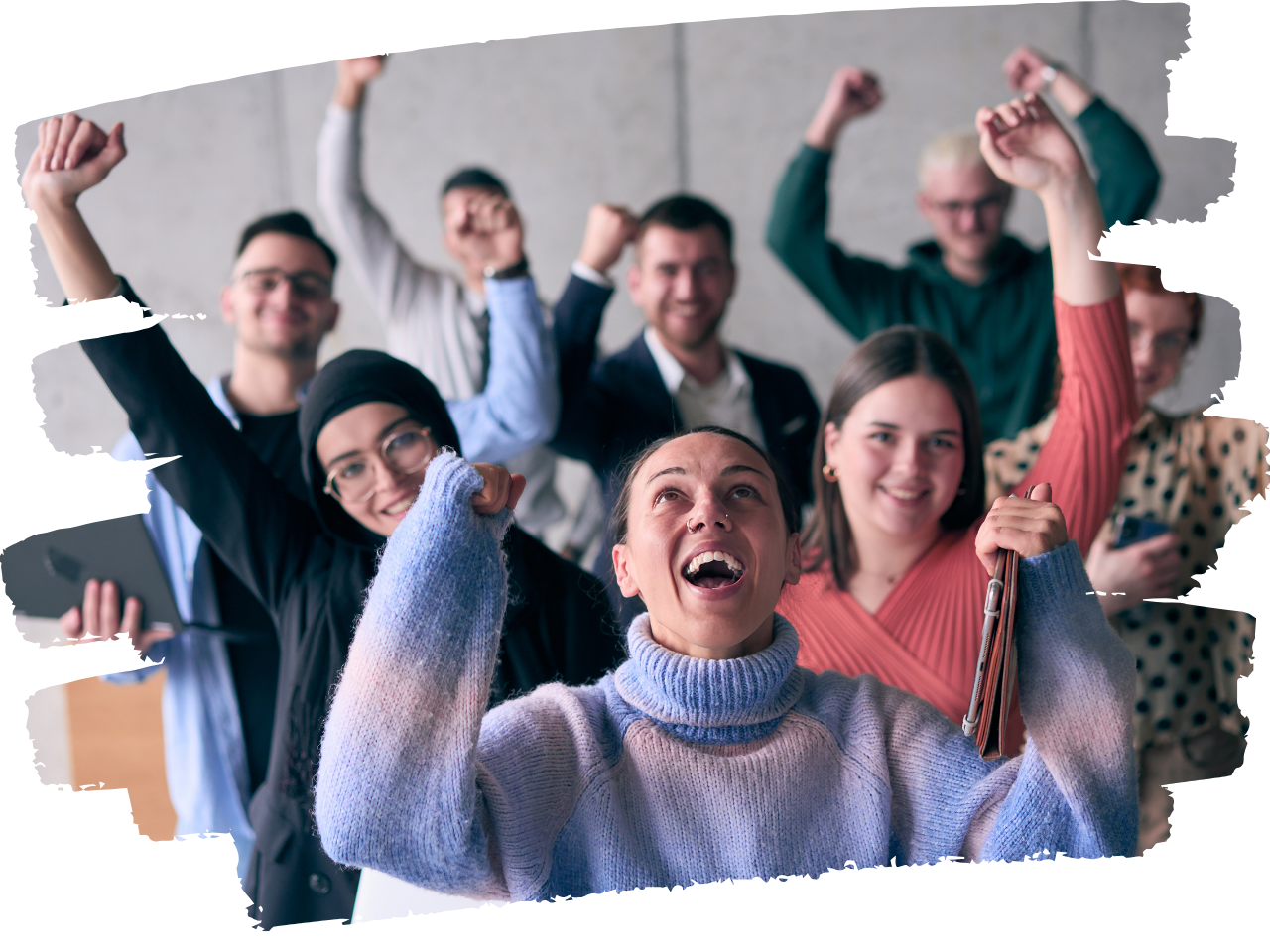 A group of adults cheering, hands held in the air. 